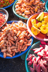 Fresh colourful fruits and vegetables in a wet market.
