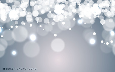 Silver abstract bokeh background sparkling lights effect. Blured circle on gray background.