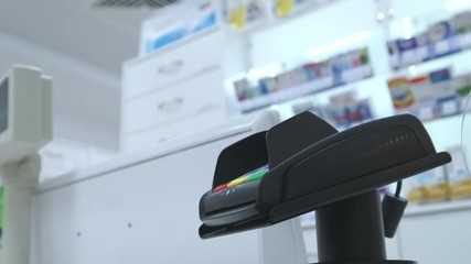 Supermarket: Checkout Counter Customer Pays with Smartphone for His Food Items.