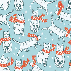 Vector Christmas cats seamless pattern. Hand drawn cute cats in red Christmas scarves on blue background.