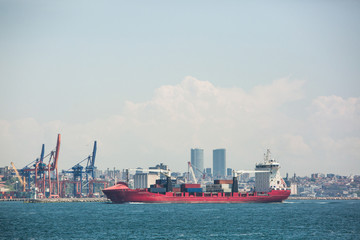 Fototapeta premium Haydarpasa Port and Container cargo ship in the Bosphorus on the background of a big city Istanbul