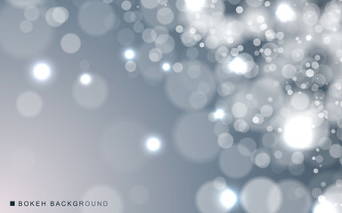 Silver abstract bokeh background sparkling lights effect. Blured circle on gray background.