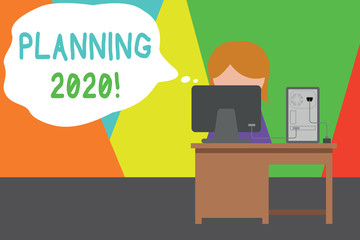 Handwriting text writing Planning 2020. Conceptual photo process of making plans for something next year Young female working office sitting desktop computer office monitor photo