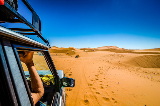 Off road car learning how to drive in sand dunes in Erg Chebbi, Morocco