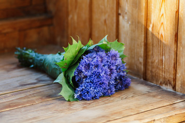 Cornflower flower. Blue beautiful flowers lie on the table. Bouquet of wildflowers.