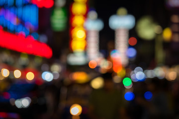 Blurred, lighting bokeh background of Bangkok Chinatown or well know as Yaowarat road. The lighting bokeh are occurred from car, vehicle and building decorate. 