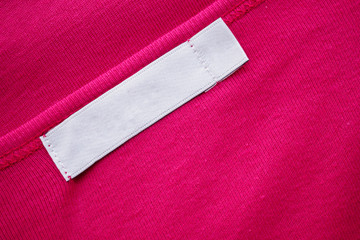 Blank white clothes tag label on new shirt