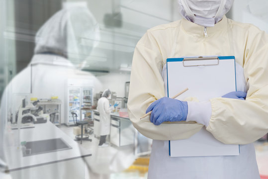 Lab worker in Protective Clothes and mask with gloves for doing research in foods factory or pharmaceutical. Double Exposure image with Laboratory Scientists Background.
