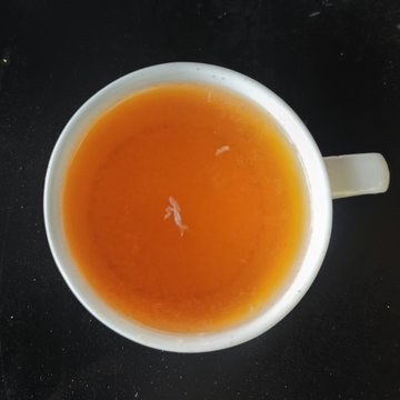 Leamon Flavoured tea in a white tea cup.