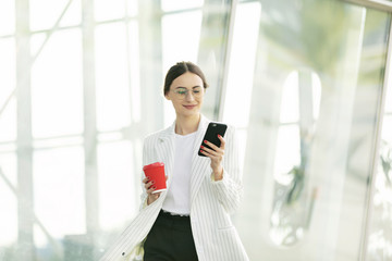 Business Woman Using Phone Near Office