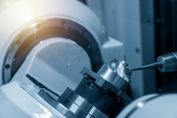 The 5-axis CNC machining center cutting the turbine blade parts with solid ball endmill tool. The...