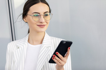 Business Woman Using Phone Near Office