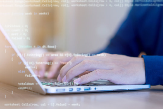 close up programmer man hand typing on keyboard at computer desktop for input coding language to software for fix bug and defect of system in operation room , development of technology concept	
