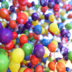 Multicolored balloons in blue sky