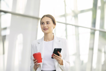 Business Woman Using Phone Near Office