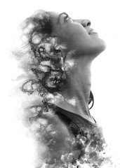 Paintography. Double Exposure portrait of a beautiful ethnic woman's profile combined with hand drawn watercolor painting. black and white