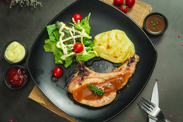 Food shot of pork chop steak with mashed potato