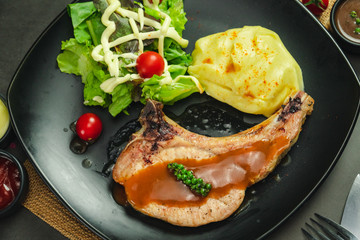 Food shot of pork chop steak with mashed potato