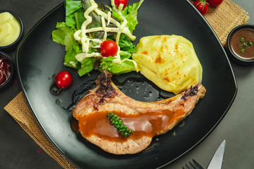 Food shot of pork chop steak with mashed potato