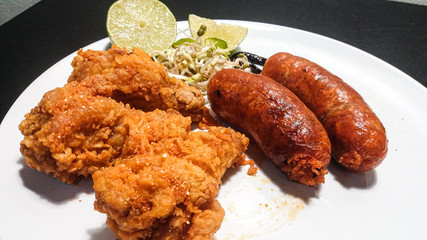 chicken fried with grilled sausages 