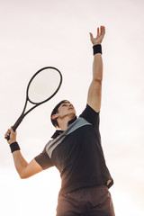 Professional tennis player serving © Jacob Lund
