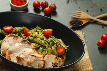 Food shot pesto pasta with grilled chicken breast