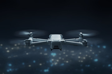 Obraz na płótnie Canvas Drone quadcopter flying above city at night