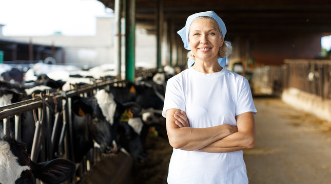 Woman Farmer On Dairy Farm