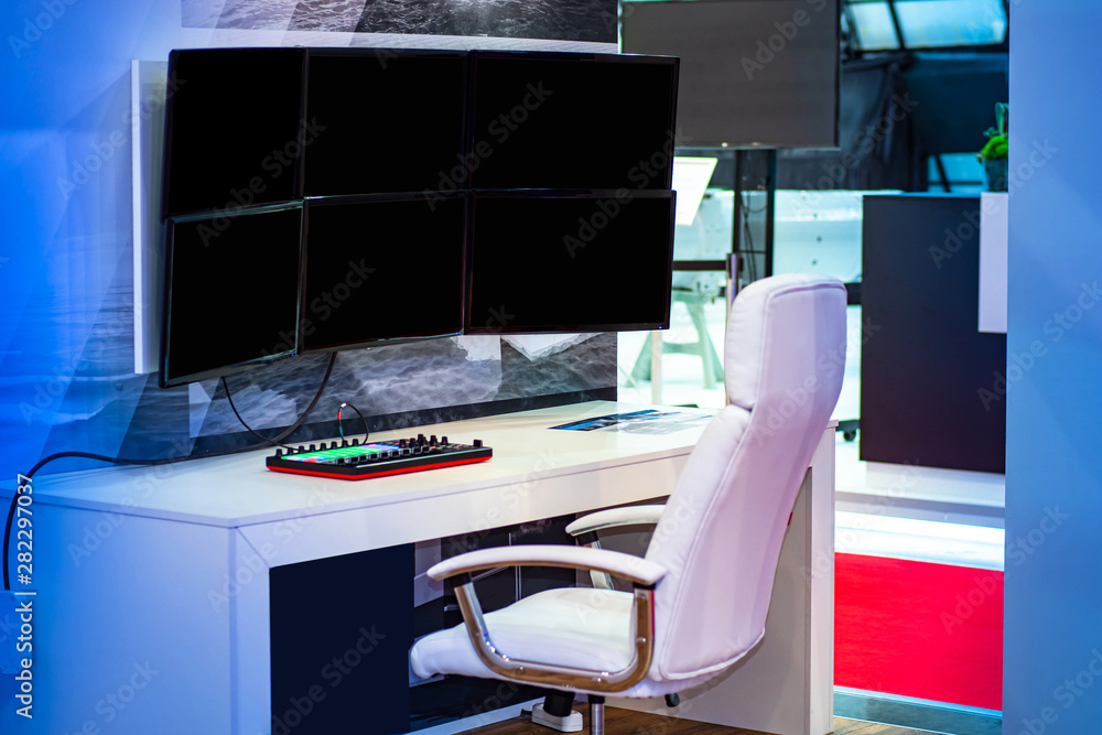 Poster desktop with computer and monitors. many different monitors to work with videos. room for video surv