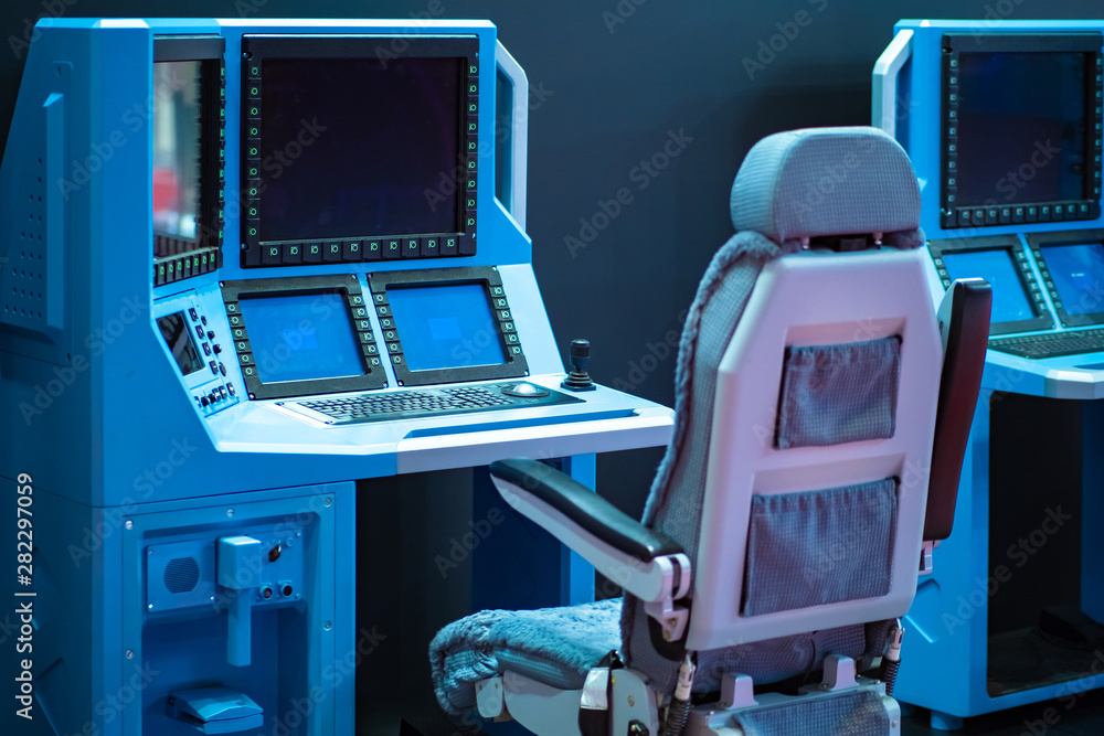 Poster armchair and table with built-in computer and monitors. workplace dispatcher in production. panel fo