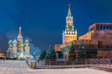 Moscow, Russia. Red Square in winter. View of the Mausoleum, the Kremlin and St. Basil's Cathedral. Snow on the Red Square.