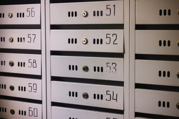 Mailboxes in an apartment house close-up. Metal mailboxes in an apartment building.