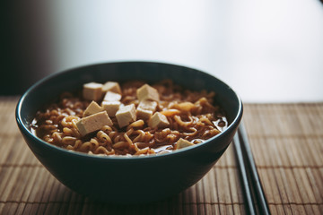 Hot tasty ramen with tofu in bowl home cooking steam Asian food