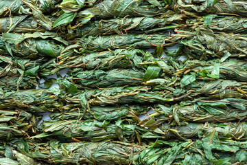 Tea production process. Tea leaf twisted by hand. Blooming Sally fermentation. 