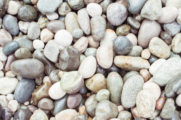 Collection of different colored stones, top view image showing variety of minerals in many shapes and colors