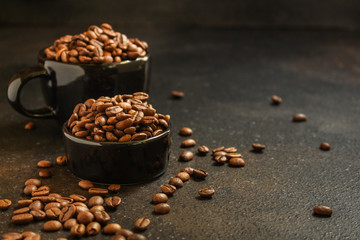 coffee beans (roasted coffee beans) Arabica and Robusta blend. Dark background. Top view . Copy space