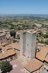 Fototapeta na wymiar Landscape with parallel towers in San Gimignano