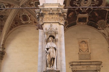 A sculpture on a loggia in Siena