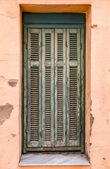 Windows with green wooden shutters