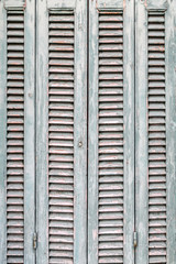Windows with green wooden shutters