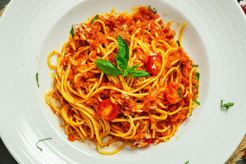 Food shot of spaghetti bolognese tomato sauce stir fried with beef