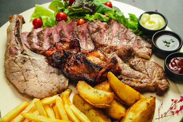 Food shot mix grilled steak with fried and salad