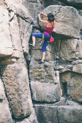 Obraz na płótnie Canvas Rock climber is training on natural terrain.