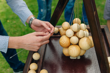 Wooden materials for solving puzzles and problems . Training with natural materials. The blocks for the tower. Board games with pieces of wood