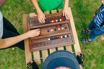 Wooden materials for solving puzzles and problems . Training with natural materials. The blocks for the tower. Board games with pieces of wood