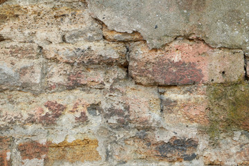Old broken wall from limestone brick and concrete, background, texture