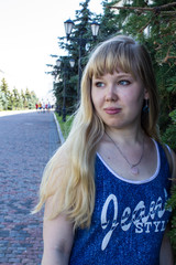 young blonde girl on a walk in the city