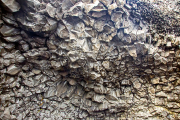 Basalt columns on a black beach in Iceland.