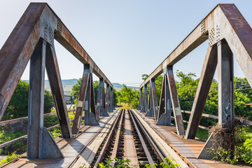 ODORHEIU SECUIESC, ROMANIA - July 2, 2019: View on bridge with railway tracks and steel support. Rusty, background. Concept teambuilding, way, ahead, straight, connection, transport, old but solid.