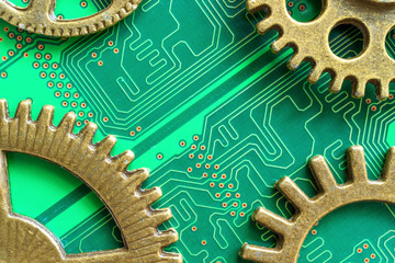 metal gears made of brass on a green chip background